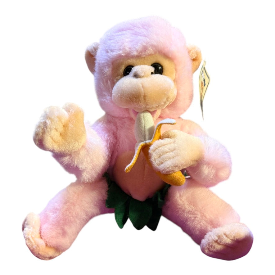 Vintage Preowned Royal Plush Pink Monkey Eating a Banana and Wearing a Leafy Green Skirt