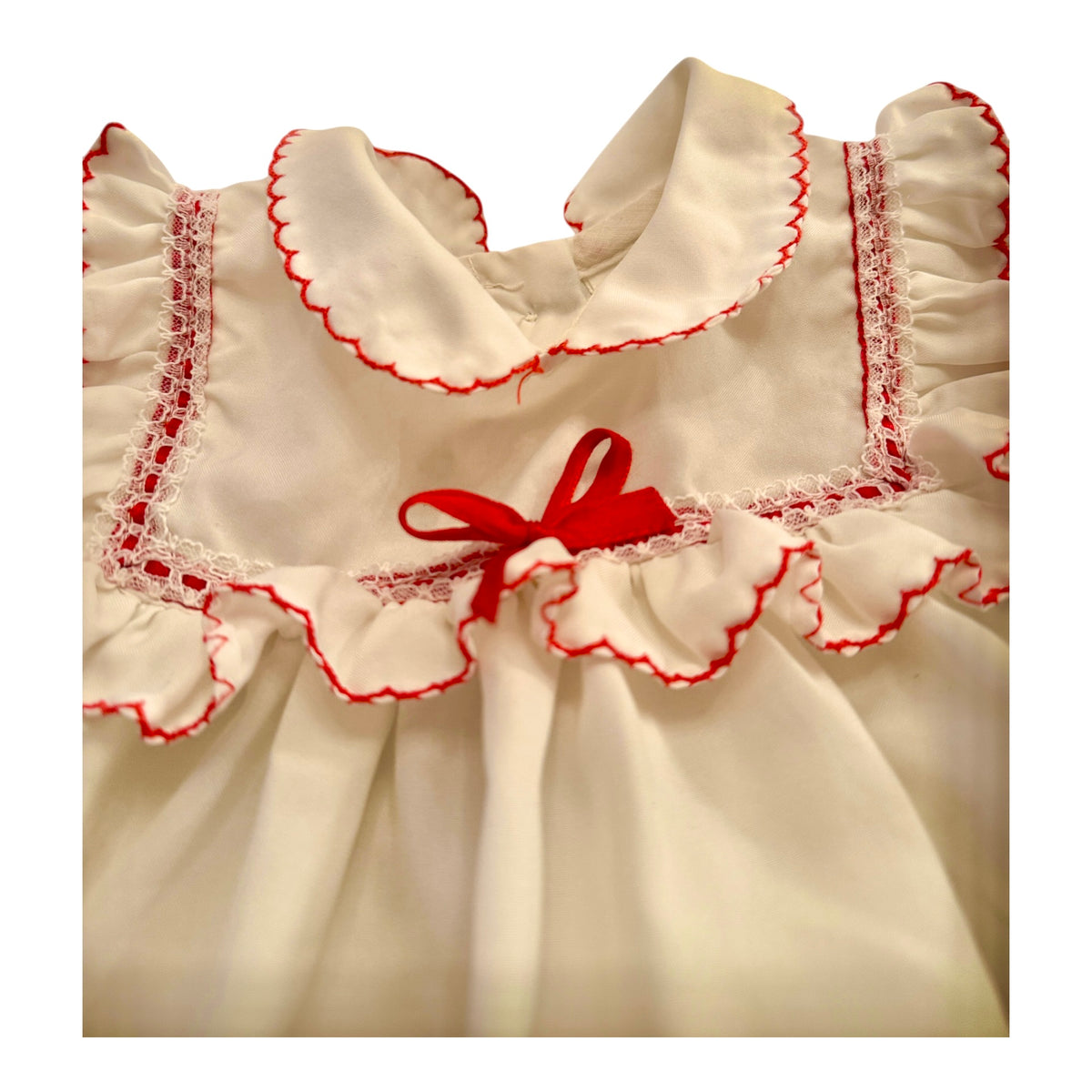 Vintage Preowned White Ruffled Baby Dress with Red Trim and Ribbon Embellishment