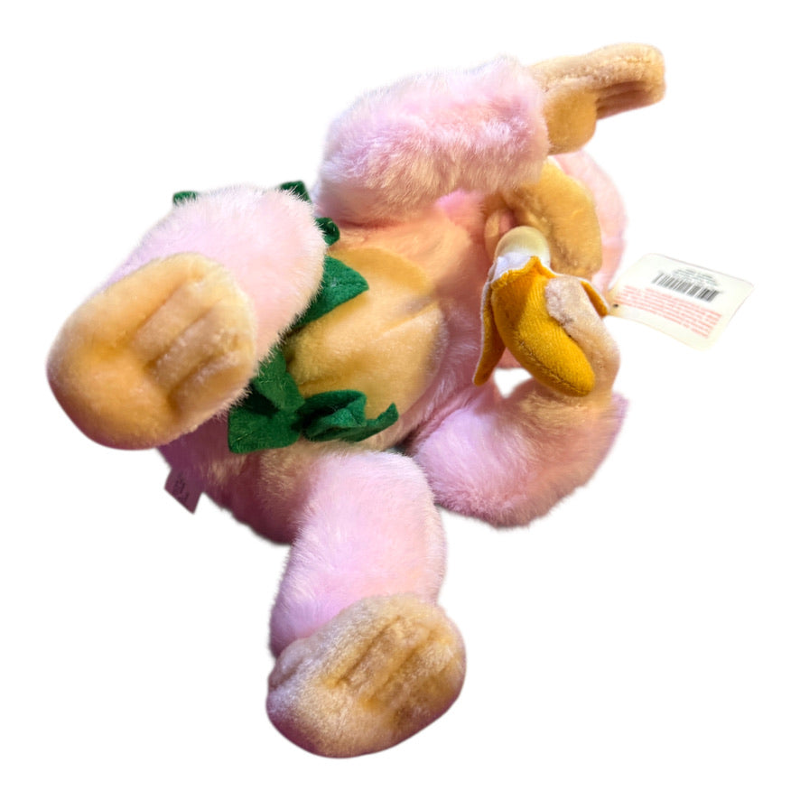Vintage Preowned Royal Plush Pink Monkey Eating a Banana and Wearing a Leafy Green Skirt