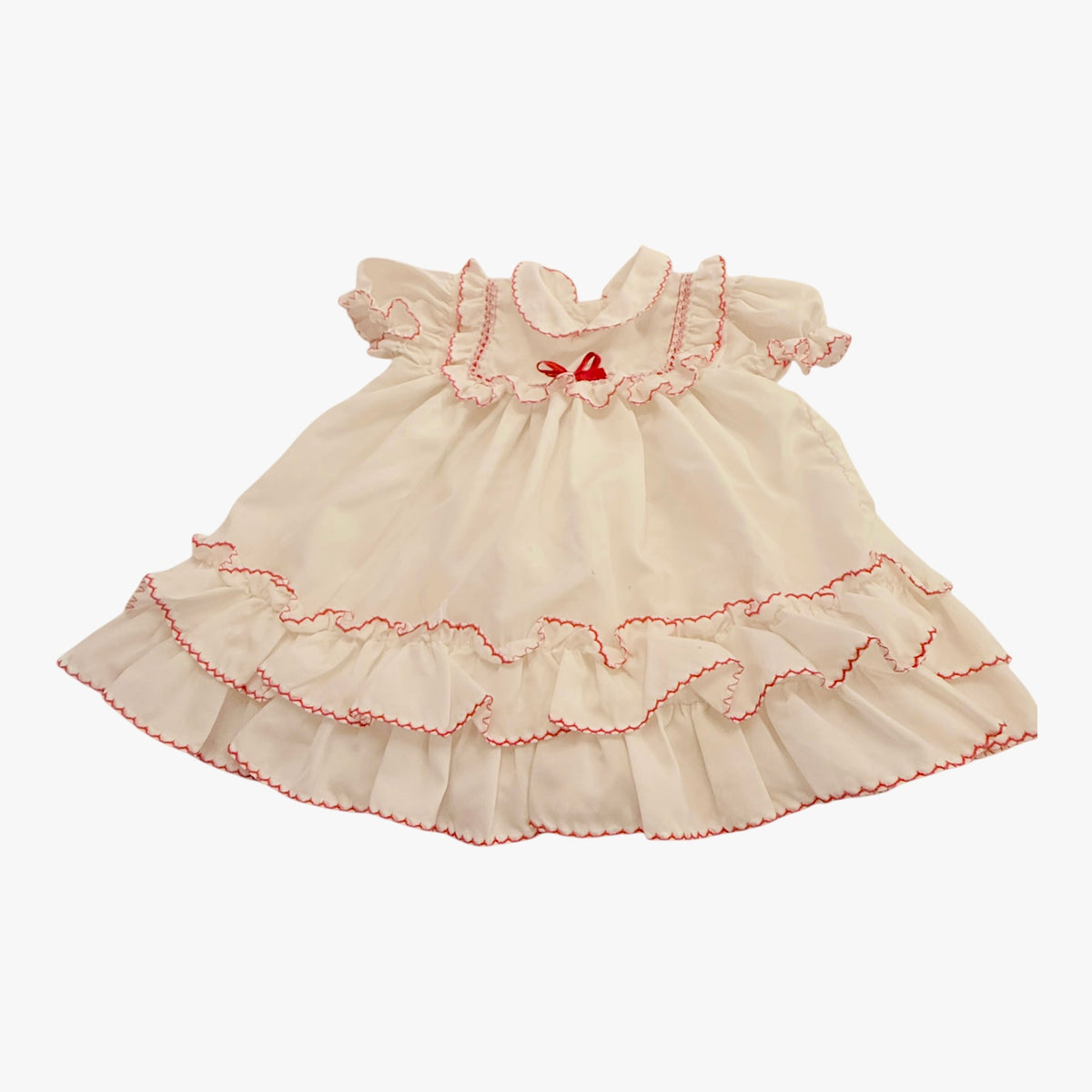 Vintage Preowned White Ruffled Baby Dress with Red Trim and Ribbon Embellishment